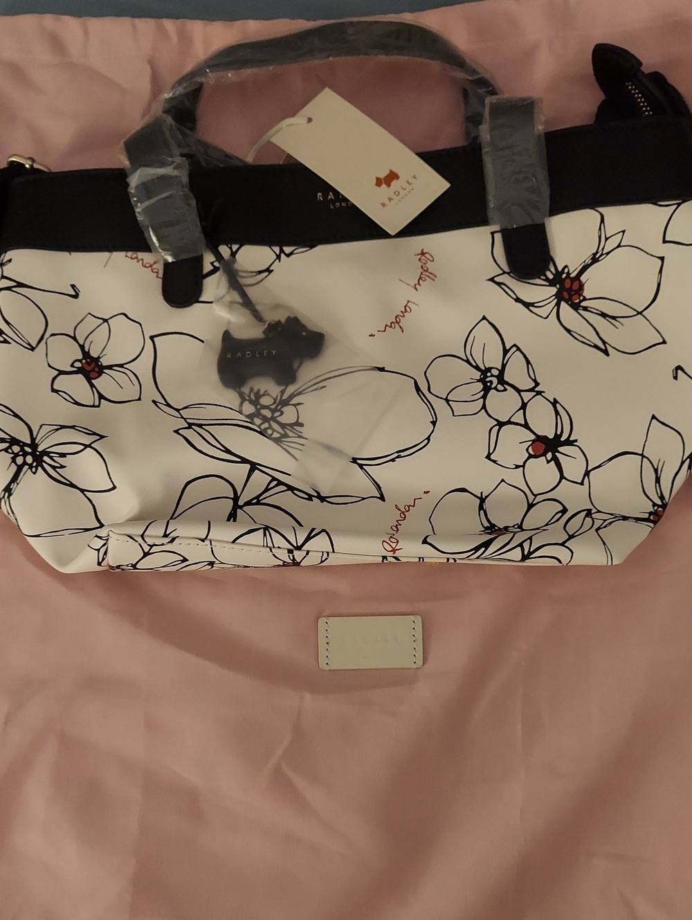 RADLEY LONDON White Floral Tote with Black Trim and Red Accents